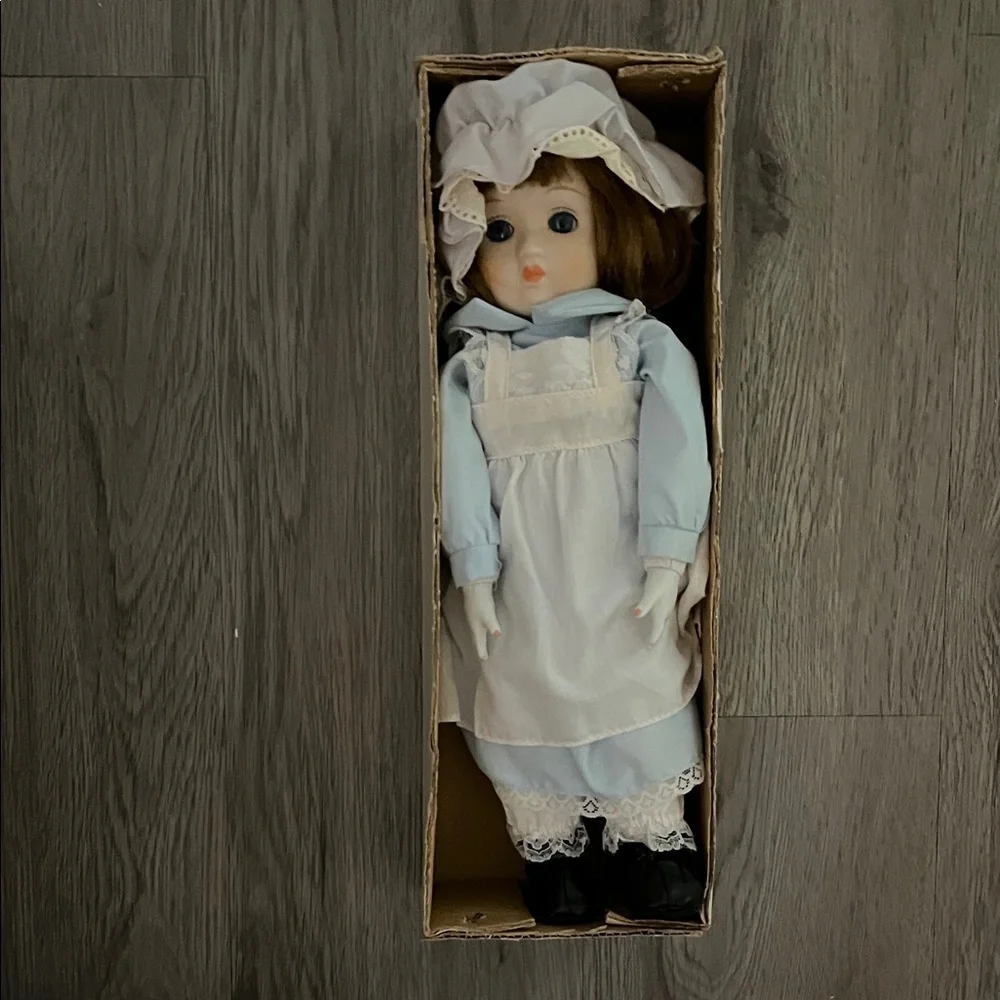 Elegant Blue and White Doll with Bonnet